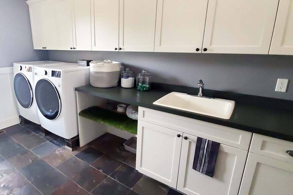 Remodeled laundry room with a special cat hangout, featuring indoor grass